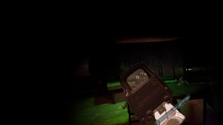 A rifle sight inside a dark room