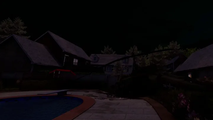 A courtyard and buildings at night